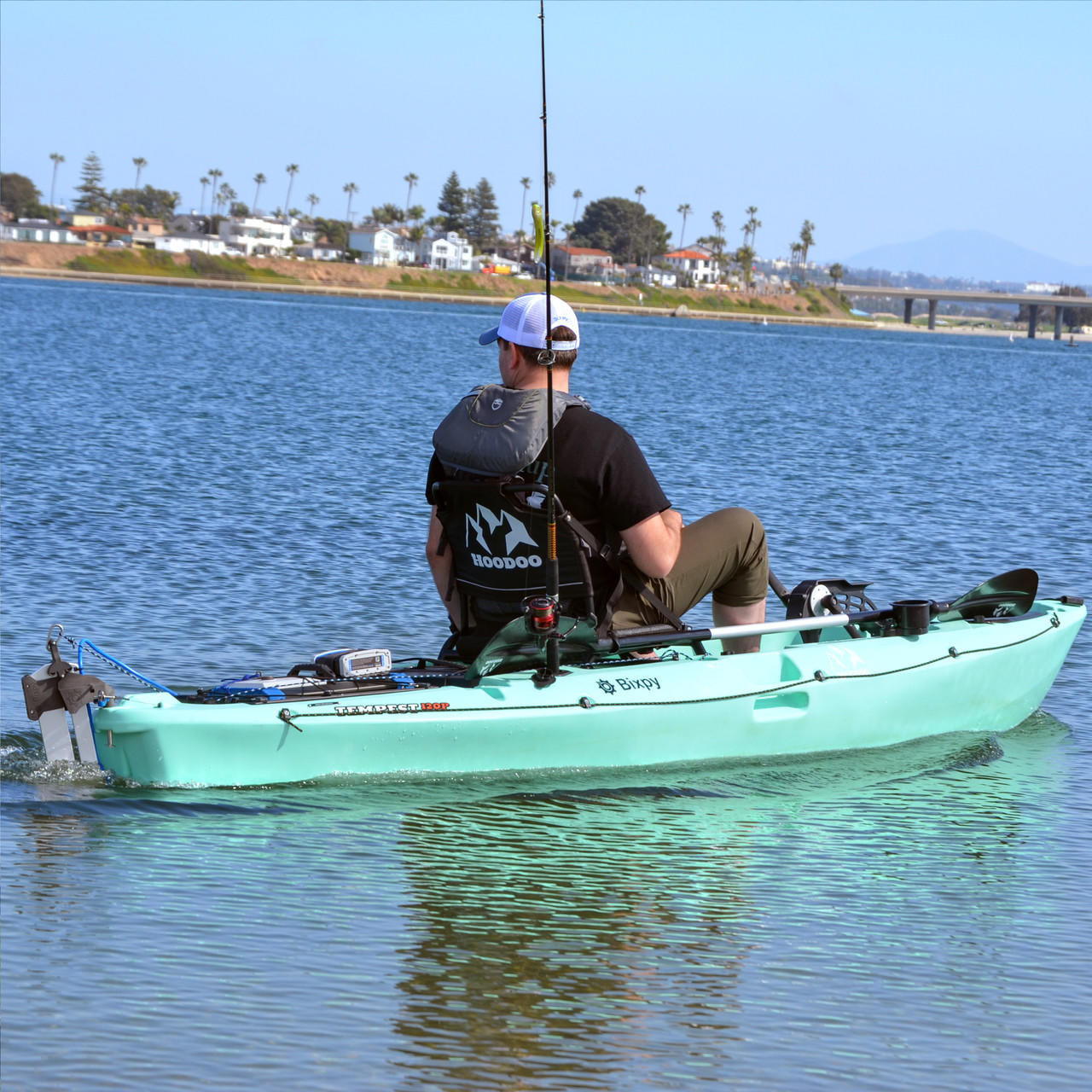 Man driving kayak with Versa Rudder™ Adapter